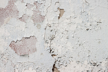 Weathered shabby peeled cement surface white painted wall texture pattern macro