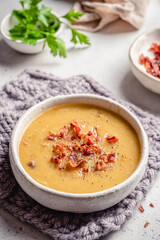 Lentil pea soup garnish with bacon and pork ribs