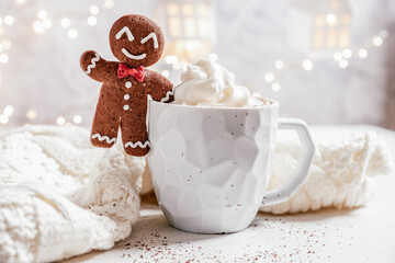 Gingerbread cookie man with a hot chocolate for Christmas holiday