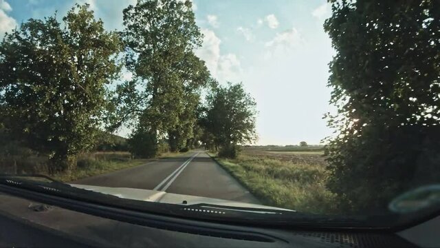 Driving car on road. View from cocpit throw front window. Trip in slowmotion.