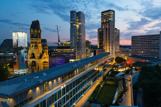 Modern skyscrapers in Berlin near the Zoologischer Garten and Hardenbergplatz after sunset.