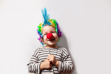 girl in clown costume with red nose