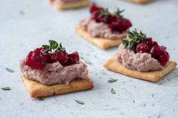 Rosemary Cracker with pate and cranberry sauce