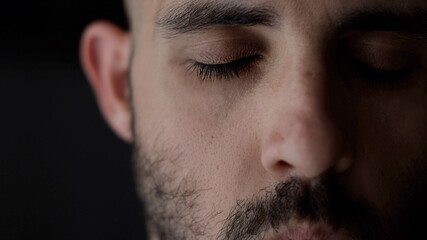 Obraz premium extreme close up portrait of meditation man. Caucasian man is meditating