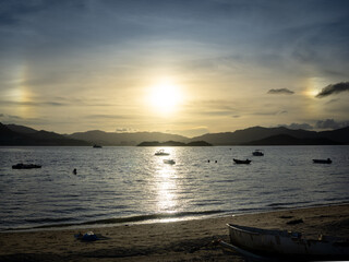 Sun dogs on the beach in Ma On Shan. Ma On Shan is a new town along the eastern coast of Tolo Harbour in the New Territories of Hong Kong