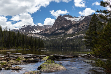 Naklejka na ściany i meble Beautiful sunny and cloudy day at hell roaring lake in the summer located in the sawtooth mountain range of central Idaho