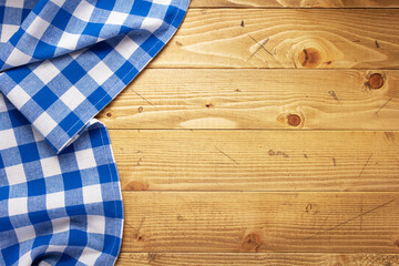 cloth napkin at old wooden board table background