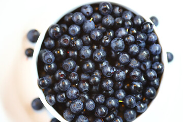 Blueberries with white bowl close-up. Macro