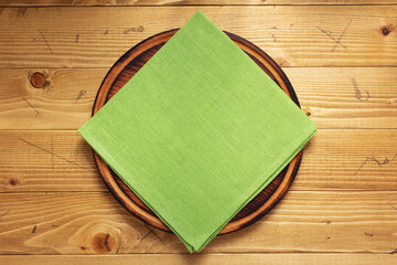 table cloth napkin and wooden pizza cutting board