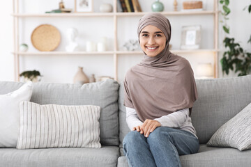 Obraz premium Modern Modesty. Portrait Of Beautiful Islamic Woman In Hijab In Home Interior