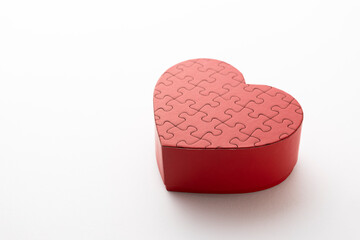 red heart shaped puzzle on white background