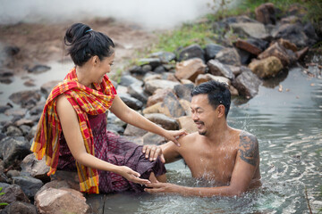Couple Love are Enjoyment bathing Together in The river  at  Countryside, Lifestyles and Thai Culture 