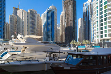 Naklejka premium Private luxury yachts moored in the city marina of an eastern country.