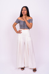 Young beautiful Asian woman against white background