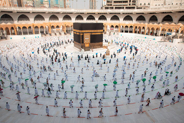Muslim pilgrims in Al Haram Mosque Makkah performing Tawaf , Hajj Season at the time of the Corona Covid 19 , Covid 19 precautionary measures.Saudi Arabia makkah at Aug 2020