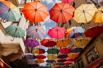 Fototapeta na wymiar Colorful umbrellas in the air on the street in Istanbul, Turkey