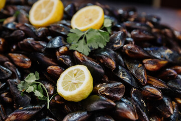 Fresh mussels with lemon on the counter at a market in Istanbul