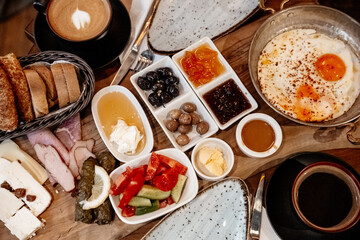 Traditional Turkish rich breakfast. A typical breakfast consists of cheese, butter, olives, eggs, tomatoes, cucumbers, jam, honey