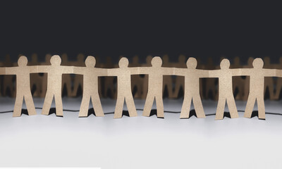 concept of social solidarity and unity strong together. coworkers teamwork collaboration. paper human doll background.