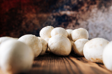 Mushrooms on a wooden background close up