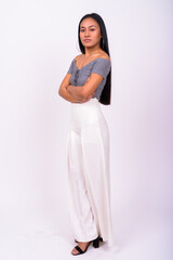 Obraz premium Young beautiful Asian woman against white background