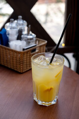 Refreshing orange drink with ice. Bar drinks.