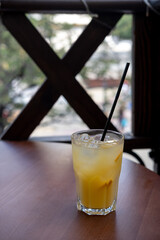 Refreshing orange drink with ice. Bar drinks.