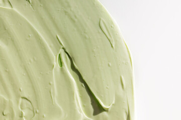 Green cosmetic clay texture close-up