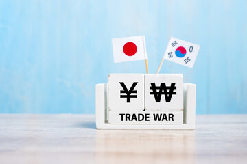 Japan and Korea trade war concept. Japanese Yen and Korean Won symbol with flags