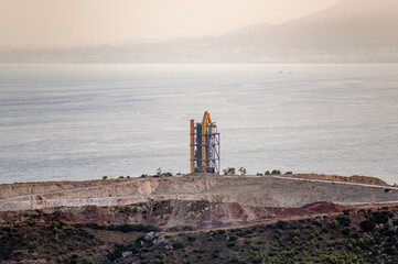 View of cement factory near the sea in Malaga city, Spain
