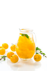 sweet cooked compote in a glass decanter of ripe yellow cherry plum
