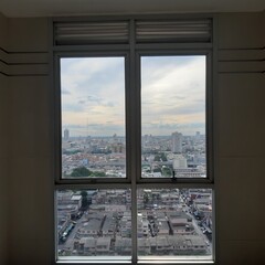 Fototapeta na wymiar View from the window of a building. Window. View of Bangkok City.