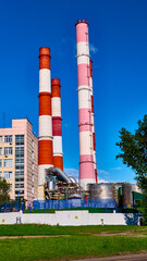 Heat station pipes in the industrial zone. color