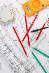 electrical engineering drawings, circuit breaker, pencils and digital multimeter