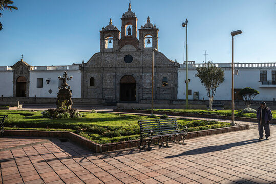 Riobamba/Ecuador - circa 2013. Catheredrale of Riobamba, catholic church. On the square people meet, feed pigeons and enjoy the sun