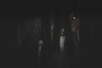 Portrait of asian woman make up ghost face with blood,Horror scene,Scary background,Halloween...