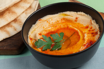 Homemade chickpea hummus with pita bread.