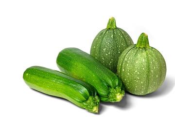 eine Gruppe runde und lange Zucchinis,