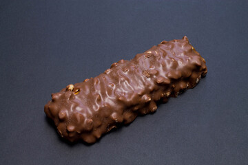Delicious chocolate bar on black background.