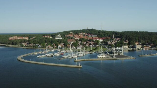 Aerial view of Nida town harbour in Curonian spit national park, Lithuania. Shot in morning light in summer time.