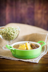 hot pea soup with meat and vegetables in a plate