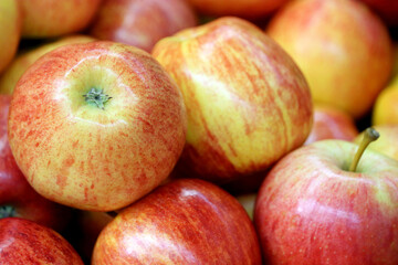 Fototapeta na wymiar Red apples close up. Fresh harvest, ripe fruits on farm market