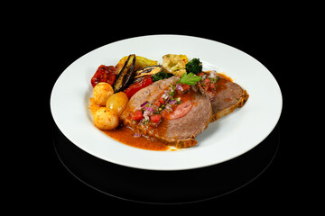 delicious dish with stuffed meat and grilled vegetables