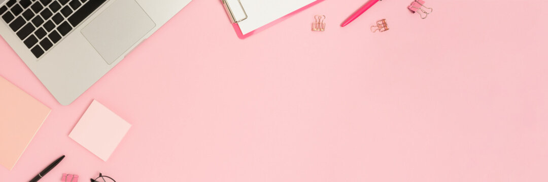 Creative workspace banner with laptop and stationery. E-learning concept with copy space.