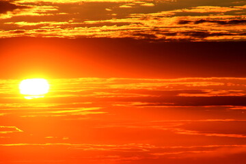 Naklejka na ściany i meble orange sun in the sky at sunset