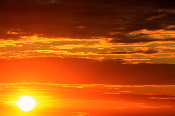 red clouds in the sky at sunset