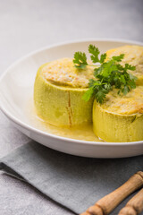 Roasted round zucchini stuffed with minced meat, vegetables, and cheese