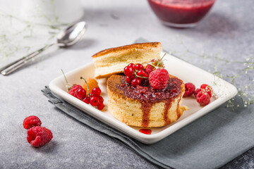 Close up Fluffy Soufflé Japanese pancake recipe with berry. Trendy asian food for breakfast.