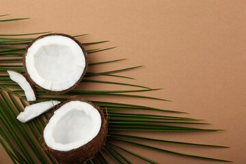 Fototapeta na wymiar broken coconut on a colored background. 