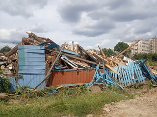 wreckage of an old destroyed wooden house, demolition of a private sector